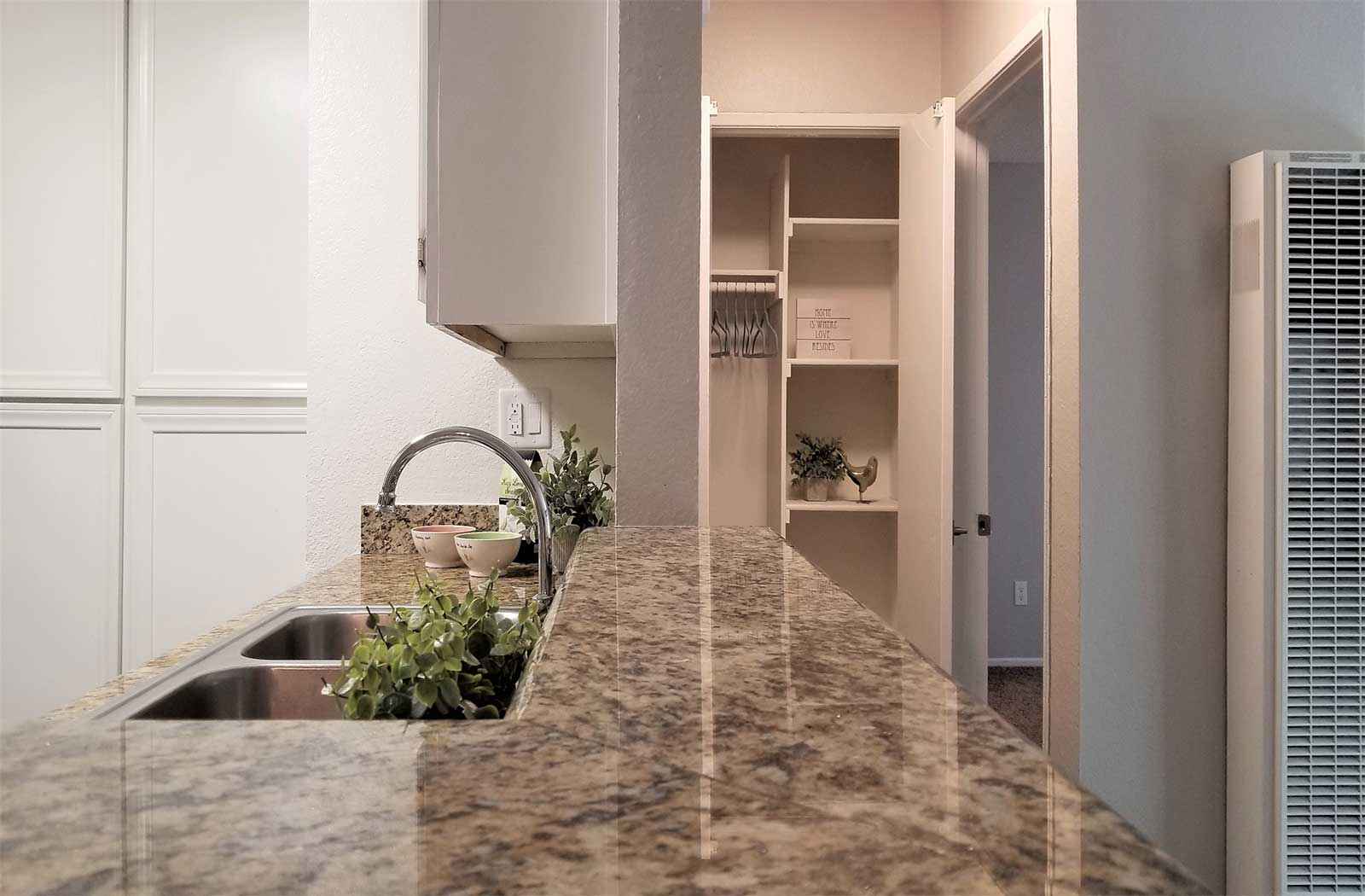 granite breakfast bar with closet view